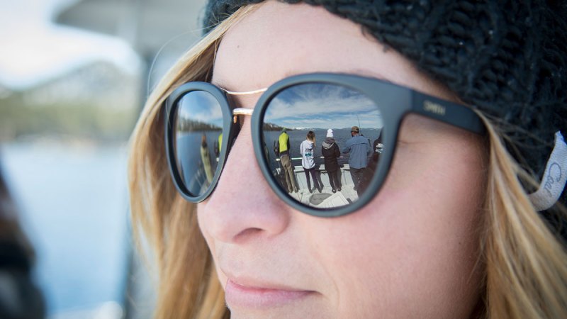 a close up of a woman wearing a hat and sunglasses
