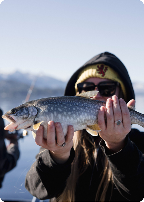 a person holding a fish