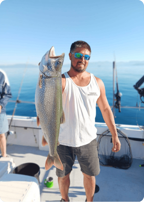 a man holding a fish
